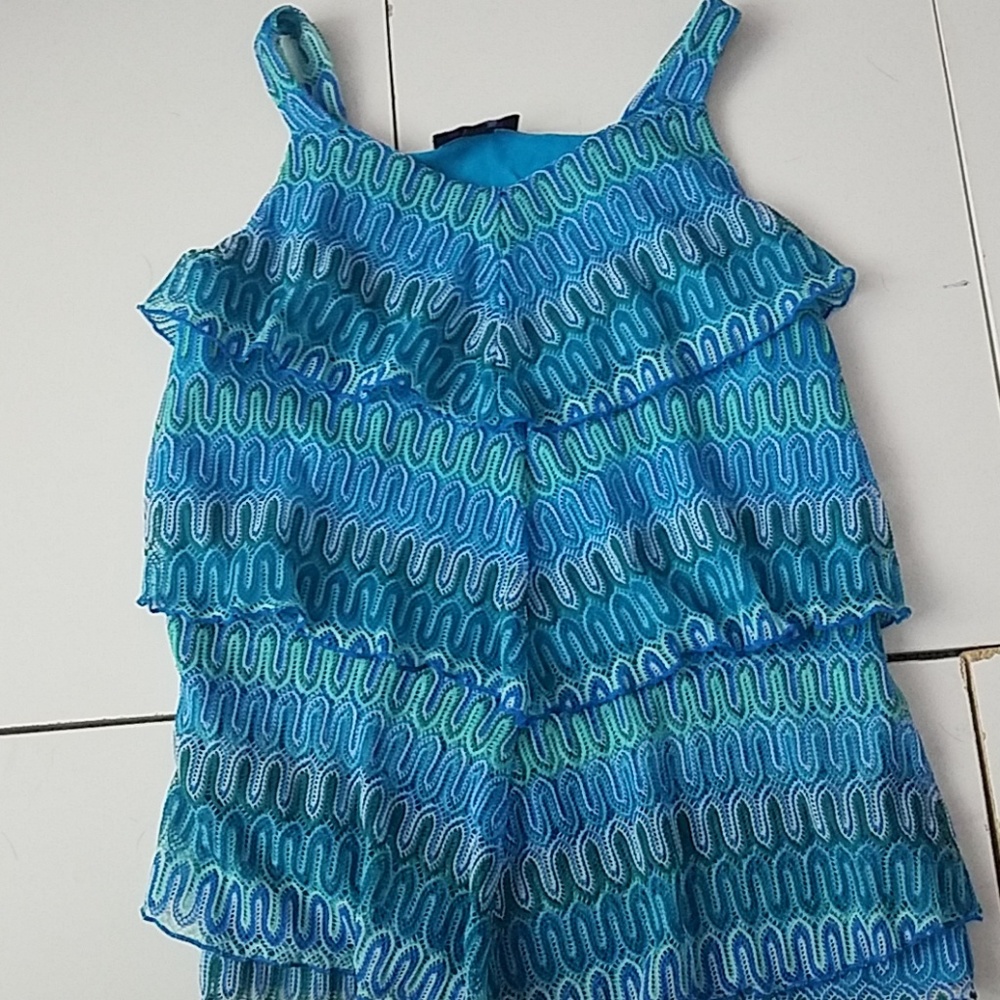 A kids teal and green blouse